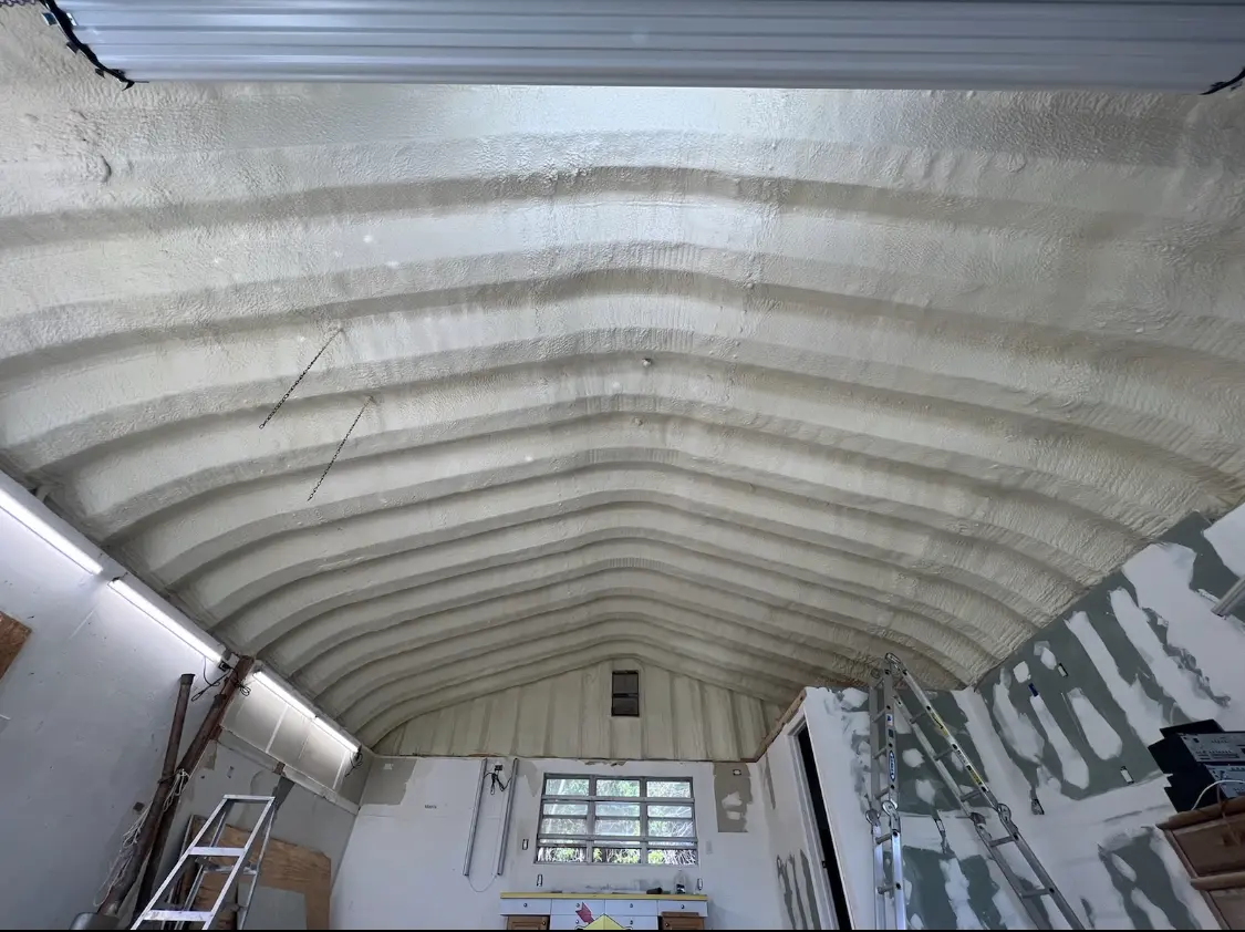 Spray polyurethane foam applied to the underside of a metal roof deck in Belgrade